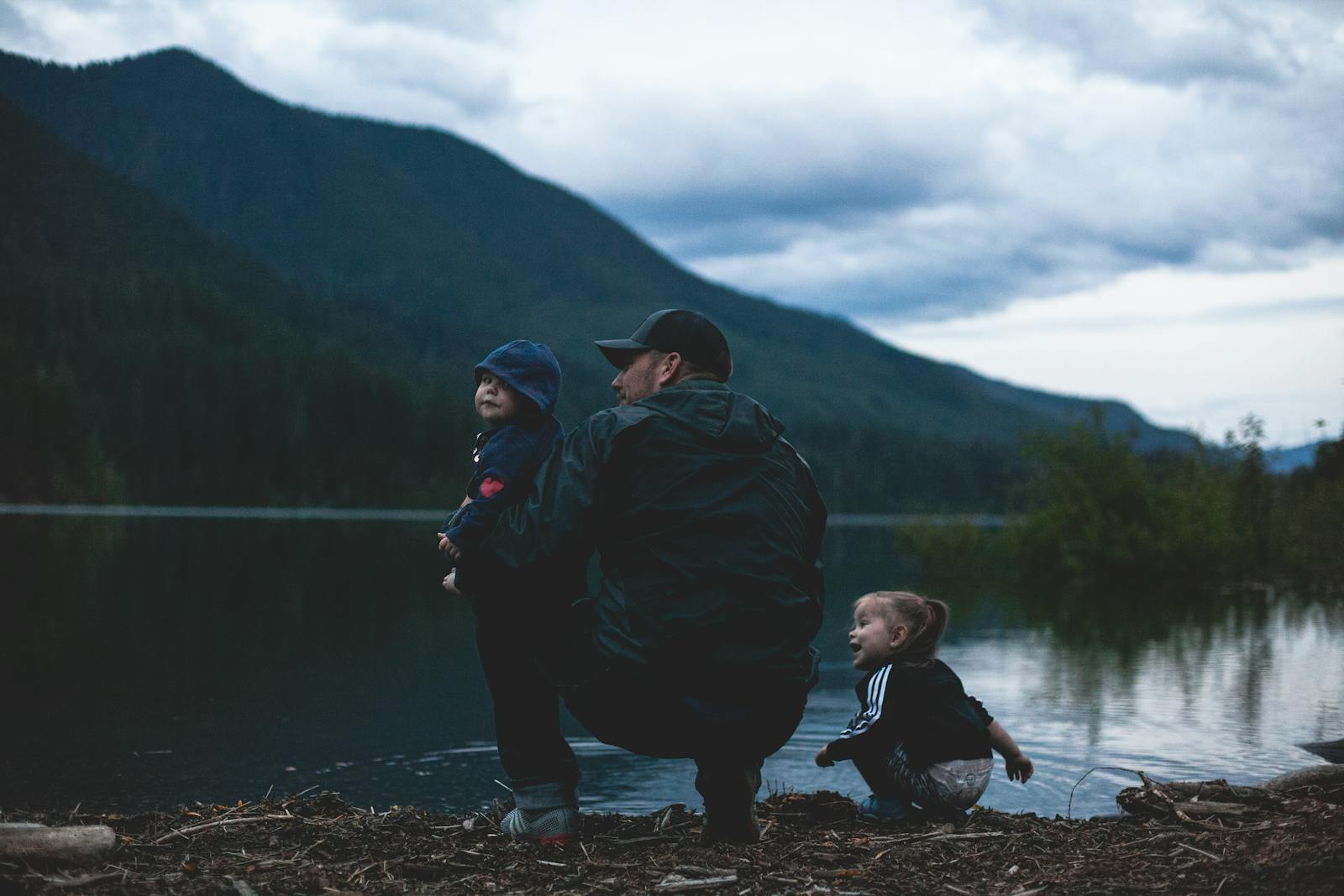 A Father and his Kids near Body of Water